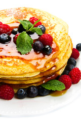 deliciuos pancake with fresh fruit on white