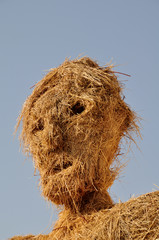 Gesicht einer Strohpuppe