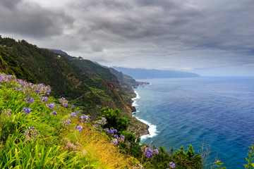 Fototapeta na wymiar Amazing view of mountains and ocean on the northern coast of Madeira near Boaventura from Vigia viewpoint, Portugal