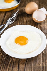 Fried Eggs on wooden background