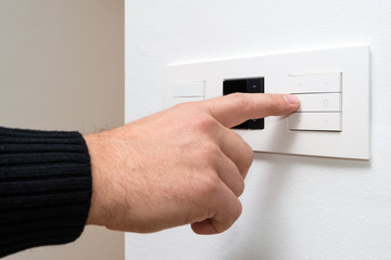 Closeup shot of man's hand controlling multipurpose switch