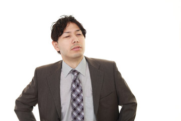疲れた表情のビジネスマン