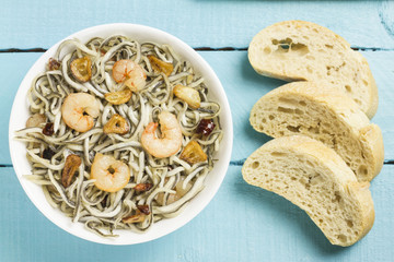 Surimi elvers with prawns, garlic and pepper.