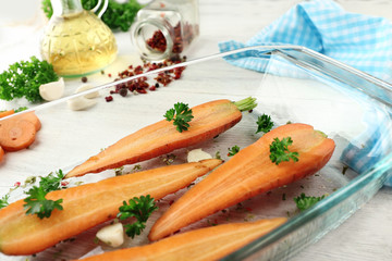 Healthy food and ingredients with sliced carrots, parsley and spices on wooden background