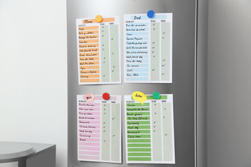 To do lists hanging on refrigerator