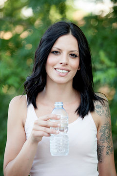 Beautiful woman drinking water