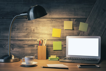 Creative desk with white laptop