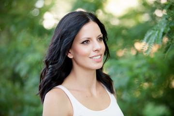 Beautiful brunette girl relaxing in the park