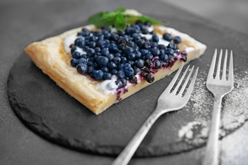 Fresh berry dessert on a slate plate
