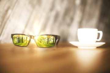 Sunglasses with forest reflection