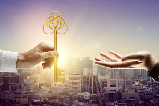 Man handing key - Powered by Adobe