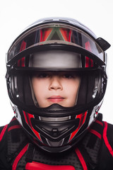 Race car or bike driver. The boy in the costume of the racer isolated on white background