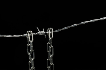 Fototapeta na wymiar Barbed wire and chain