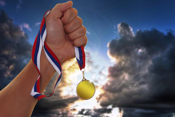 The sportsman holding a gold medal