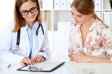Fototapeta premium Doctor and patient sitting at the desk