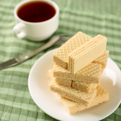 Wafer biscuits served with tea.