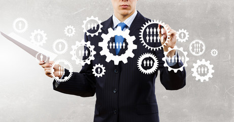 Man presenting teamwork concept . Mixed media