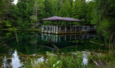 Palms Book State Park In Michigan's Upper Peninsula.  Raft for viewing Michigan's largest freshwater spring in Palms Book State Park in Manistique, Michigan.