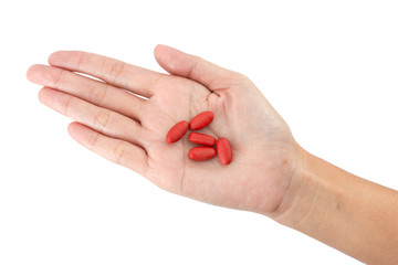 Isolated of Hand holding red pills with clipping path
