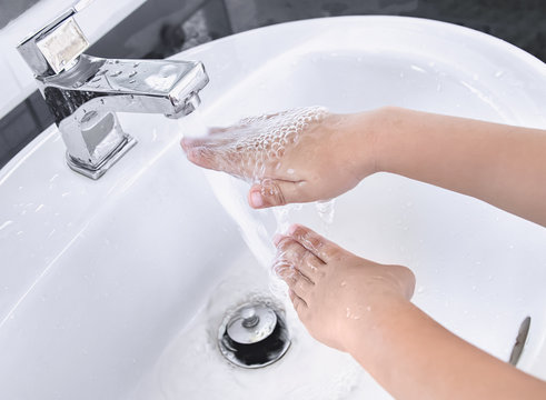 Kids Washing Hand On White Basin