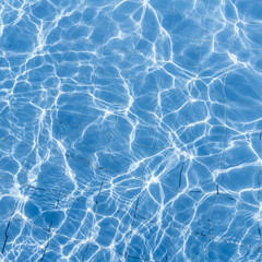 Fototapeta na wymiar Surface of swimming pool water background