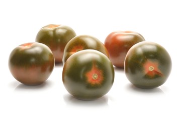 kumato tomatoes isolated on white background