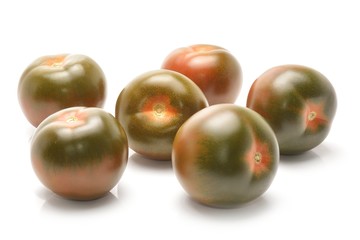 kumato tomatoes isolated on white background