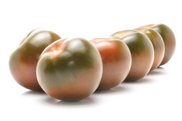 kumato tomatoes isolated on white background