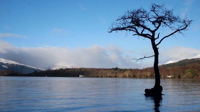 Timelapse of Loch Tay in the Scottish Highlands during a stunning clear winters day with snow on Ben Lawers, Scotland