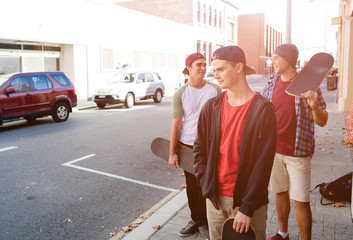 Guys skateboarders in street