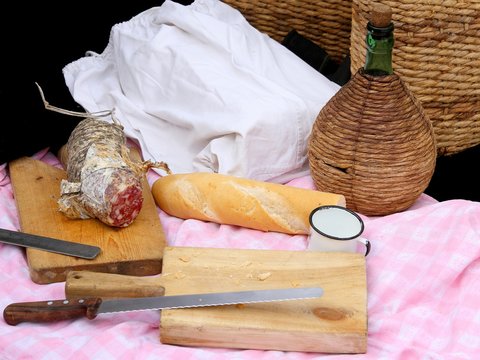 picinc with salami, fragrant bread and big knife