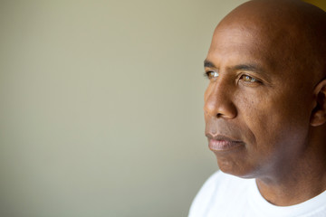 Mature African American man in deep thought.