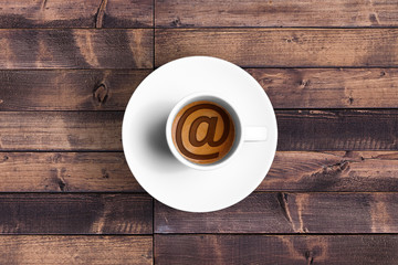 great italian espresso coffee in a white cup with et @ email symbol shape, technology concept