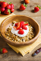 Homemade granola with yogurt and strawberries
