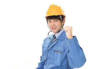 ガッツポーズの労働者