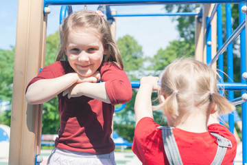 Obraz premium girls playing on playground.