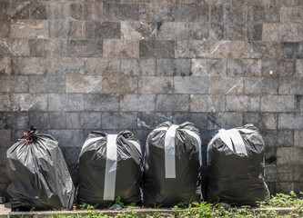 Garbage bag on sidewalk