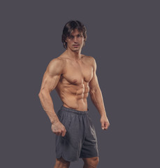 Fototapeta premium Portrait of muscular male in shorts.