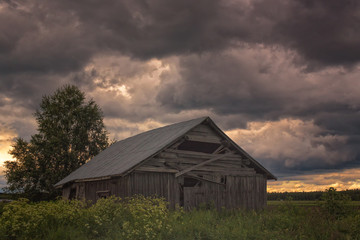 Obraz premium Stormy Clouds Over The Barn House