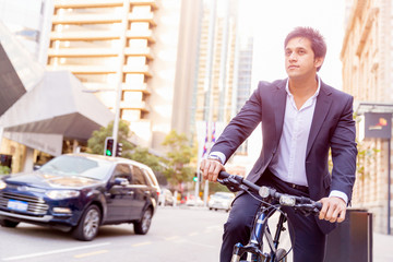 Naklejka premium Successful businessman with bicycle