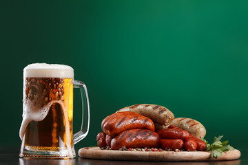 Grilled sausages with glass of beer