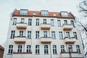 Fototapeta na wymiar White colored exterior of apartment building