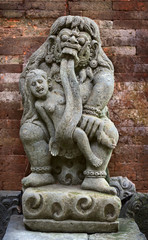 Fototapeta na wymiar Antique statue of child-eating Rangda. Indonesia, Bali.