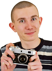 Satisfied young man with vintage photo camera