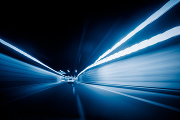 Car drives through a tunnel