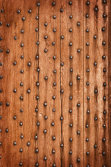 Vintage wooden background with metal rivets