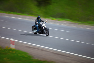 Man traveling on a classic motorcycle - chopper