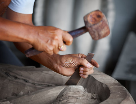 Hands woodcarver with the tools