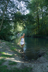 Fototapeta premium Girl taking a bath in a magical forrest