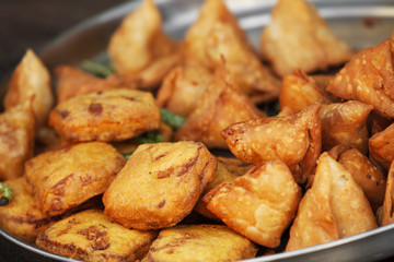 Traditional Indian dish samosa on the open market